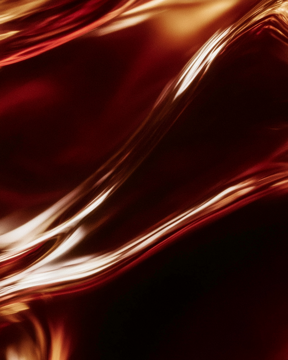 Deep wine-red folds of glossy vitamin E oil